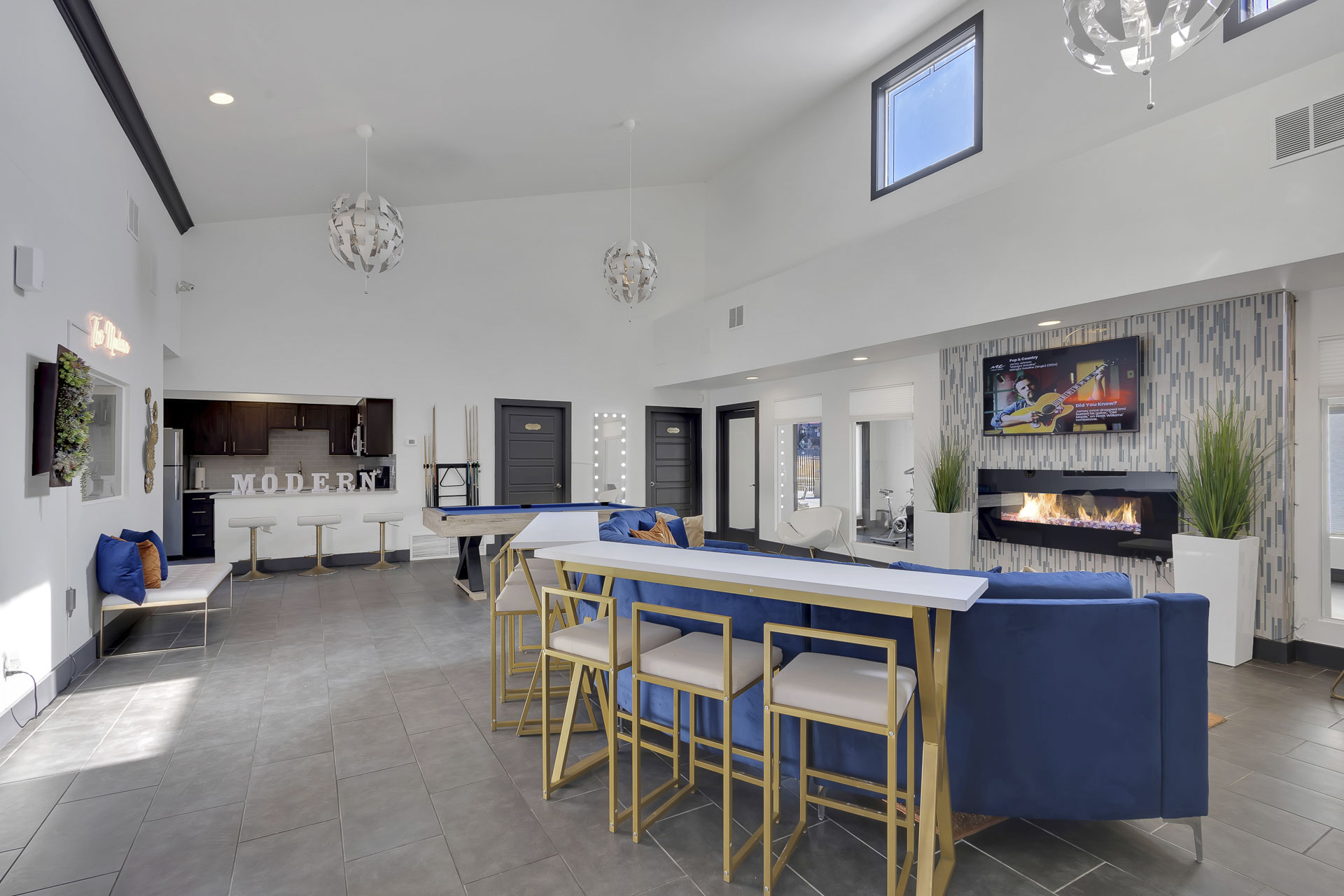Clubhouse with bar seating and entertainment area